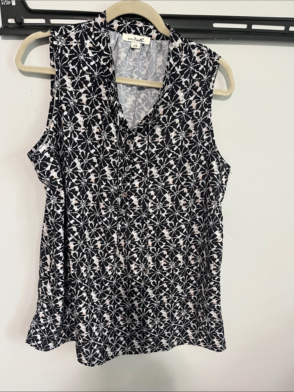 Black and white sleeveless blouse